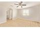 This bedroom features carpeted floors, a ceiling fan, and natural light from a window at 4853 S Charger --, Mesa, AZ 85212