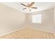 A cozy bedroom featuring a ceiling fan and a window offering natural light at 4853 S Charger --, Mesa, AZ 85212