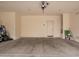 A spacious two car garage with clean floors and a door leading to the house at 4853 S Charger --, Mesa, AZ 85212