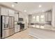 Modern kitchen with stainless steel appliances, light grey cabinetry, and granite countertops at 4853 S Charger --, Mesa, AZ 85212