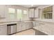 Bright kitchen featuring stainless steel appliances, granite countertops, light grey cabinetry and tile flooring at 4853 S Charger --, Mesa, AZ 85212