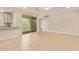 Open-concept living room with tile flooring, sliding glass doors to the patio, and stairs at 4853 S Charger --, Mesa, AZ 85212