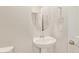 This powder room features a pedestal sink and a round mirror above it at 4853 S Charger --, Mesa, AZ 85212