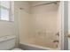 Bathroom featuring a bathtub, a toilet and window at 5104 W Fulton St, Phoenix, AZ 85043