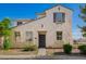 Charming two-story home featuring a desert-themed landscape and neutral color palette at 5104 W Fulton St, Phoenix, AZ 85043