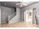 Inviting living room with neutral walls, a ceiling fan, and a sliding glass door to the patio at 5104 W Fulton St, Phoenix, AZ 85043