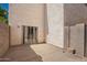 Enclosed patio featuring stucco walls, concrete, and a sliding glass door leading indoors at 5104 W Fulton St, Phoenix, AZ 85043