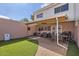 Beautiful backyard featuring a covered patio, lawn, grill, and outdoor seating at 5166 N 83Rd St, Scottsdale, AZ 85250