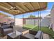 Backyard featuring a covered patio, comfortable seating and artificial turf area at 5166 N 83Rd St, Scottsdale, AZ 85250