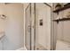 Modern bathroom features a glass shower with white tiled walls and updated fixtures at 5166 N 83Rd St, Scottsdale, AZ 85250