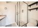 Modern bathroom with glass-enclosed shower, updated vanity, and neutral tile at 5166 N 83Rd St, Scottsdale, AZ 85250
