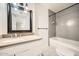 Neutral bathroom featuring stylish tile, vanity and shower-tub combo with subway tile at 5166 N 83Rd St, Scottsdale, AZ 85250