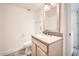 Bathroom with tile floors, a vanity with a granite counter and brushed nickel faucet at 5166 N 83Rd St, Scottsdale, AZ 85250