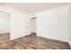 Bright bedroom features wood-look floors and closet with mirrored sliding doors at 5166 N 83Rd St, Scottsdale, AZ 85250