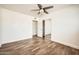 Bright bedroom features wood-look floors, ceiling fan, closet with mirrored sliding doors at 5166 N 83Rd St, Scottsdale, AZ 85250