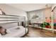 Cozy bedroom with a bunk bed, desk area, and tropical-themed wall art at 5166 N 83Rd St, Scottsdale, AZ 85250
