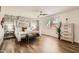 Stylish main bedroom showcases a four-poster bed, wood floors, and ample natural light at 5166 N 83Rd St, Scottsdale, AZ 85250