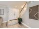 Bright entryway featuring tile flooring, staircase, double doors, and stylish wall decor at 5166 N 83Rd St, Scottsdale, AZ 85250