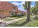 Charming townhome complex featuring well-maintained lawns, sidewalks, and distinctive red tile roofs at 5166 N 83Rd St, Scottsdale, AZ 85250