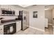 Updated kitchen featuring stainless steel appliances, tile floors, and modern lighting at 5166 N 83Rd St, Scottsdale, AZ 85250