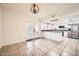 Open floor plan showcasing a kitchen with granite countertops, stainless steel appliances and tile floors at 5166 N 83Rd St, Scottsdale, AZ 85250