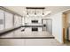 Updated kitchen featuring stainless steel appliances, white cabinets, and granite countertops at 5166 N 83Rd St, Scottsdale, AZ 85250