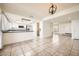Bright living space connecting the living room and kitchen with neutral tile flooring and lots of light at 5166 N 83Rd St, Scottsdale, AZ 85250
