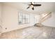 Inviting living area with shuttered windows, tile flooring and a ceiling fan at 5166 N 83Rd St, Scottsdale, AZ 85250