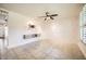 Bright living room boasts stylish paneling, tile flooring, and a modern ceiling fan at 5166 N 83Rd St, Scottsdale, AZ 85250