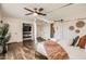 Spacious main bedroom features a four-poster bed, modern decor, and natural light at 5166 N 83Rd St, Scottsdale, AZ 85250