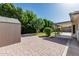 The home has a spacious yard with a storage shed and covered patio at 560 E San Pedro Ave, Gilbert, AZ 85234