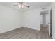 A bedroom with wood-look flooring and a ceiling fan at 560 E San Pedro Ave, Gilbert, AZ 85234