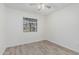 Bedroom featuring light gray wood-look flooring and a window at 560 E San Pedro Ave, Gilbert, AZ 85234