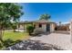 Exterior showing yard, patio, walkway, and driveway to parking area at 560 E San Pedro Ave, Gilbert, AZ 85234