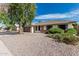 Well-kept single-story home boasting desert landscaping, a tile roof, and a cozy front porch at 560 E San Pedro Ave, Gilbert, AZ 85234