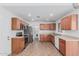 Well-equipped kitchen featuring stainless steel appliances, ample cabinet space, and tiled flooring at 560 E San Pedro Ave, Gilbert, AZ 85234