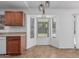 Bright breakfast nook with a charming bay window and modern pendant lighting at 560 E San Pedro Ave, Gilbert, AZ 85234
