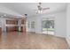 Open living area with a view of the kitchen, stainless steel appliances, and a sliding door to the patio at 560 E San Pedro Ave, Gilbert, AZ 85234