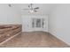 Open living area featuring a stylish accent wall, ceiling fan, and bright natural light at 560 E San Pedro Ave, Gilbert, AZ 85234
