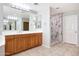 Bathroom with a marble walk-in shower, and double sink vanity at 5726 W Park View Ln, Glendale, AZ 85310