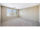Carpeted bedroom with window shutters and neutral colored walls at 5726 W Park View Ln, Glendale, AZ 85310