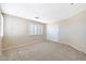 Inviting bedroom with neutral carpet, plantation shutters, and a closet for ample storage at 5726 W Park View Ln, Glendale, AZ 85310