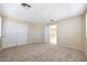 Open carpeted bedroom with neutral walls and a closet at 5726 W Park View Ln, Glendale, AZ 85310