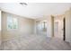 Neutral carpet and walls highlight this bright bedroom with mirrored closet and natural light at 5726 W Park View Ln, Glendale, AZ 85310