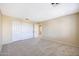 Spacious carpeted bedroom featuring an interior door at 5726 W Park View Ln, Glendale, AZ 85310