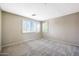 Bright bedroom with neutral carpet and walls, featuring shuttered windows for natural light at 5726 W Park View Ln, Glendale, AZ 85310