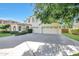 Gorgeous two-story home featuring a three-car garage and a large driveway with beautiful curb appeal at 5726 W Park View Ln, Glendale, AZ 85310