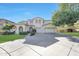 Stunning two-story home with a three-car garage, a spacious driveway, and well-maintained landscaping at 5726 W Park View Ln, Glendale, AZ 85310