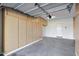 Well-organized garage featuring built-in storage cabinets and a door leading to the interior at 5726 W Park View Ln, Glendale, AZ 85310
