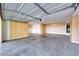 Spacious garage with ample storage cabinets, overhead lighting, and a clean concrete floor at 5726 W Park View Ln, Glendale, AZ 85310